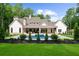 Expansive backyard with a sparkling pool, lush lawn, and serene wooded backdrop, ideal for outdoor living at 1084 Wrights Mill Rd, Canton, GA 30115
