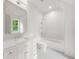 Bathroom with white vanity, marble countertop, and tiled shower at 1084 Wrights Mill Rd, Canton, GA 30115