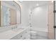 Bathroom features a large mirror, stylish vanity, and tile surround shower, creating a luxurious and inviting space at 1084 Wrights Mill Rd, Canton, GA 30115