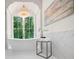 Stunning bathroom featuring a standalone tub and large window with beautiful backyard views at 1084 Wrights Mill Rd, Canton, GA 30115