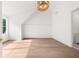 Bright bedroom with hardwood floors, paneled accent wall and modern lighting fixture at 1084 Wrights Mill Rd, Canton, GA 30115