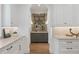 Charming butler's pantry features custom cabinets, marble countertops and unique backsplash with arched entryway at 1084 Wrights Mill Rd, Canton, GA 30115