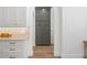 Pantry area with custom gray cabinetry, marble countertops, and contrasting hardware at 1084 Wrights Mill Rd, Canton, GA 30115