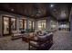 Comfortable outdoor living area featuring a brick floor, wood ceiling, and an outdoor kitchen at 1084 Wrights Mill Rd, Canton, GA 30115