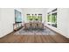 Bright dining room features large windows, modern chandelier, and stylish area rug at 1084 Wrights Mill Rd, Canton, GA 30115