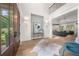Elegant foyer with hardwood floors, a grand staircase, and views into the open living area, creating a welcoming entrance at 1084 Wrights Mill Rd, Canton, GA 30115