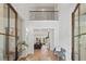 Entry foyer features hardwood floors, high ceilings, a bench, and views into the open living spaces at 1084 Wrights Mill Rd, Canton, GA 30115