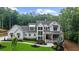 Stunning two-story home with a well-manicured lawn and a walkway leading to the front porch at 1084 Wrights Mill Rd, Canton, GA 30115