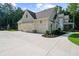 Attached three-car garage with ample parking space, offering convenience and functionality for homeowners at 1084 Wrights Mill Rd, Canton, GA 30115