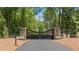 Impressive gated entrance with brick pillars, adding privacy and security to the property at 1084 Wrights Mill Rd, Canton, GA 30115