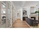 Hallway leading to living room, featuring hardwood floors and natural light at 1084 Wrights Mill Rd, Canton, GA 30115