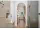 Long hallway with built-in cabinets, arched doorways, and natural light at 1084 Wrights Mill Rd, Canton, GA 30115
