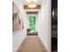 Inviting hallway with hardwood floors, window seat, natural light, and stylish decor at 1084 Wrights Mill Rd, Canton, GA 30115
