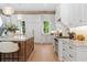 Open kitchen with island, stainless steel appliances, and view to the backyard at 1084 Wrights Mill Rd, Canton, GA 30115