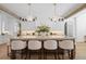 Bright, open kitchen with an island, pendant lighting, and white cabinetry at 1084 Wrights Mill Rd, Canton, GA 30115