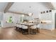 Spacious kitchen with hardwood floors, island seating, and modern appliances at 1084 Wrights Mill Rd, Canton, GA 30115