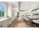 Well-lit kitchen featuring white cabinets, modern appliances, and a large island at 1084 Wrights Mill Rd, Canton, GA 30115