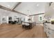 Open-concept kitchen featuring a large island, stainless appliances, and hardwood floors at 1084 Wrights Mill Rd, Canton, GA 30115