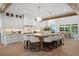 Large kitchen with island and seating, stainless appliances, and view to dining area at 1084 Wrights Mill Rd, Canton, GA 30115