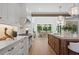 Spacious kitchen boasts a large island, farmhouse sink, and an eat-in dining area at 1084 Wrights Mill Rd, Canton, GA 30115