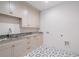 Laundry room with cabinets and a stone countertop, providing a functional and stylish space at 1084 Wrights Mill Rd, Canton, GA 30115