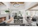 Cozy living room with fireplace, comfortable seating, and views of the kitchen at 1084 Wrights Mill Rd, Canton, GA 30115