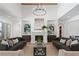 Beautiful living room with hardwood floors, large fireplace, and two sofas at 1084 Wrights Mill Rd, Canton, GA 30115