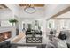 Cozy living room with hardwood floors, a fireplace, and comfortable seating at 1084 Wrights Mill Rd, Canton, GA 30115