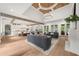 Open-concept living room with wood beams, fireplace, and access to the backyard at 1084 Wrights Mill Rd, Canton, GA 30115