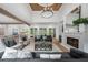 Bright living room with a stone fireplace, wood floors, and modern furnishings at 1084 Wrights Mill Rd, Canton, GA 30115