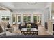 Spacious living room with fireplace and French doors overlooking backyard at 1084 Wrights Mill Rd, Canton, GA 30115