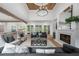 Elegant living room with a fireplace, hardwood floors, and lots of natural light at 1084 Wrights Mill Rd, Canton, GA 30115