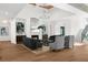 Spacious living room with high ceilings, hardwood floors, stylish furnishings, and fireplace at 1084 Wrights Mill Rd, Canton, GA 30115