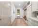 Hallway with built-in storage, bench, and decorative pillows creating an organized and inviting space at 1084 Wrights Mill Rd, Canton, GA 30115