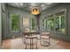 Stylish home office with grey walls, decorative ceiling, large windows with tree views and modern lighting at 1084 Wrights Mill Rd, Canton, GA 30115