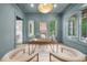 Stylish home office with a custom desk, chic decor, and natural light, creating an inviting and productive workspace at 1084 Wrights Mill Rd, Canton, GA 30115