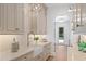 Walk-in pantry with marble countertops, farmhouse sink, ample storage and exterior door at 1084 Wrights Mill Rd, Canton, GA 30115