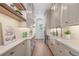 Walk-in pantry with marble countertops, farmhouse sink, and ample cabinet storage at 1084 Wrights Mill Rd, Canton, GA 30115
