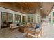 Expansive covered patio with fireplace, outdoor kitchen, and ample seating, ideal for entertaining at 1084 Wrights Mill Rd, Canton, GA 30115