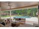 Relaxing outdoor patio overlooking a sparkling pool and lush greenery, perfect for enjoying the outdoors at 1084 Wrights Mill Rd, Canton, GA 30115