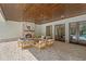 Spacious covered patio boasts a brick fireplace, wooden ceiling, and seamless transition to the outdoors at 1084 Wrights Mill Rd, Canton, GA 30115