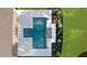 Aerial view of a modern rectangular pool with attached spa and elegant landscaping at 1084 Wrights Mill Rd, Canton, GA 30115