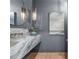 Stylish powder room featuring marble countertops, modern fixtures, and elegant lighting, creating a luxurious feel at 1084 Wrights Mill Rd, Canton, GA 30115