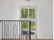 Open staircase with views of the yard and lots of natural light at 1084 Wrights Mill Rd, Canton, GA 30115