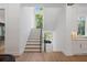 Bright staircase featuring natural light and modern railing at 1084 Wrights Mill Rd, Canton, GA 30115
