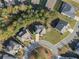 Aerial view of home in a cul-de-sac with a lush green lawn surrounded by mature trees at 308 Evening Rain Crst, Canton, GA 30114
