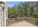 Exterior shot of a wooden deck overlooking a private wooded backyard at 308 Evening Rain Crst, Canton, GA 30114