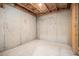 Unfinished basement corner featuring concrete walls and exposed ceiling insulation at 308 Evening Rain Crst, Canton, GA 30114