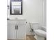 Well-lit bathroom featuring a vanity with modern fixtures, toilet, and tiled flooring at 308 Evening Rain Crst, Canton, GA 30114