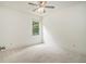 Neutral bedroom with a ceiling fan and window view, carpeted floor at 308 Evening Rain Crst, Canton, GA 30114